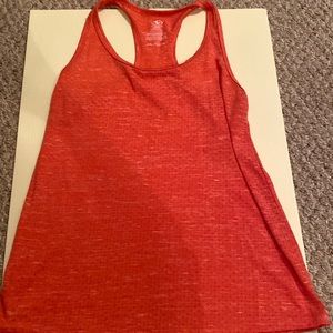 Alethic tank top, more of a pink/reddish color in person. Comfortable material.